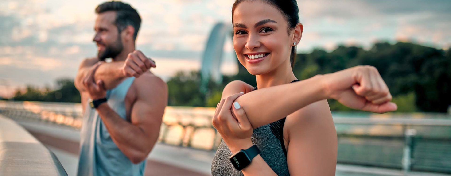 Man and woman stretching before exercise