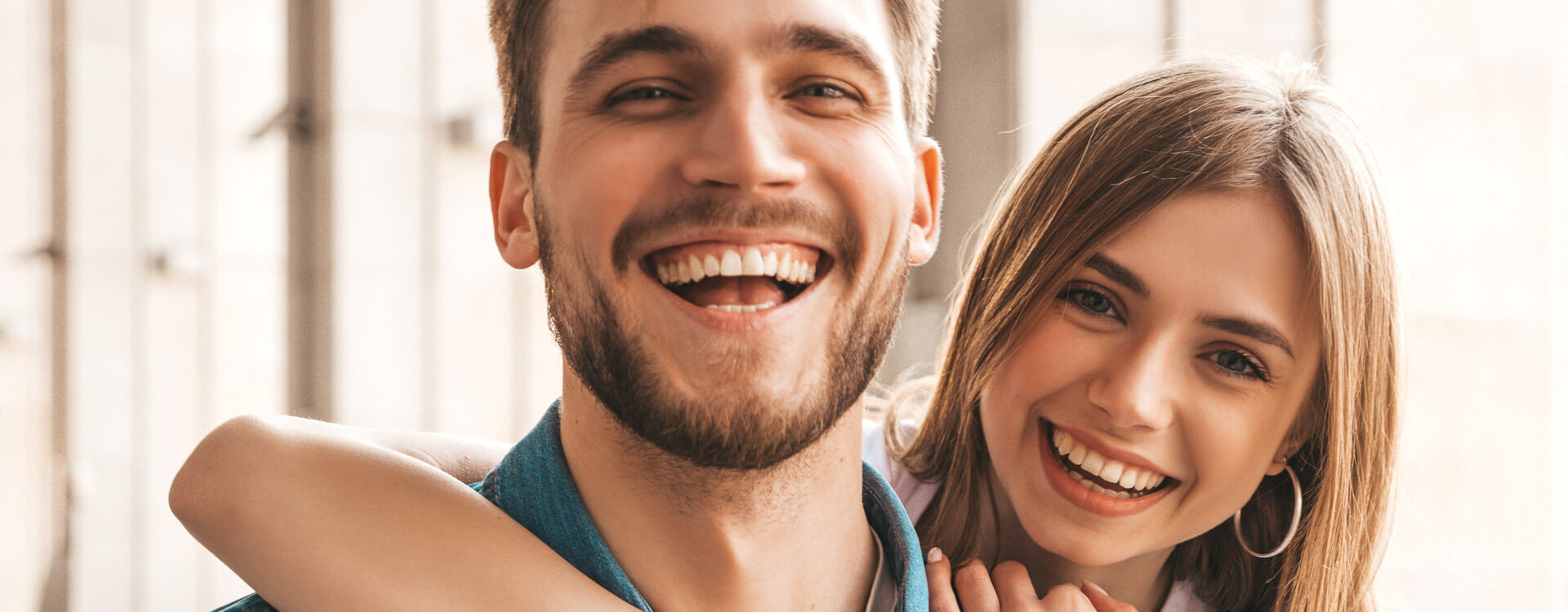 Young man and woman smiling together