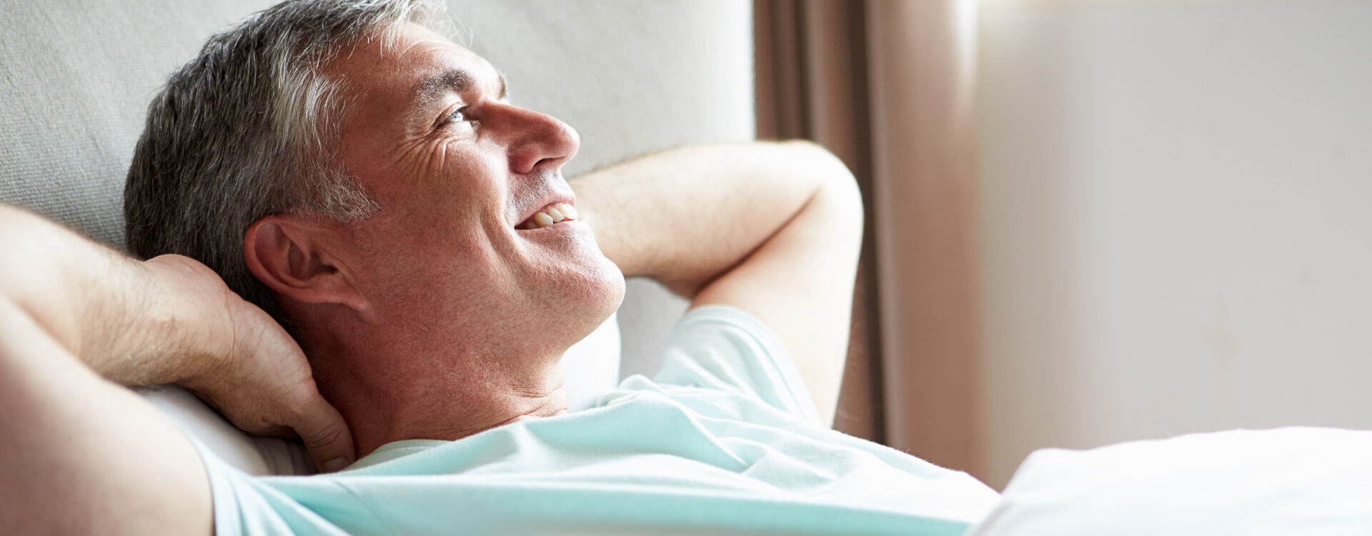 Middle-aged man relaxing and smiling