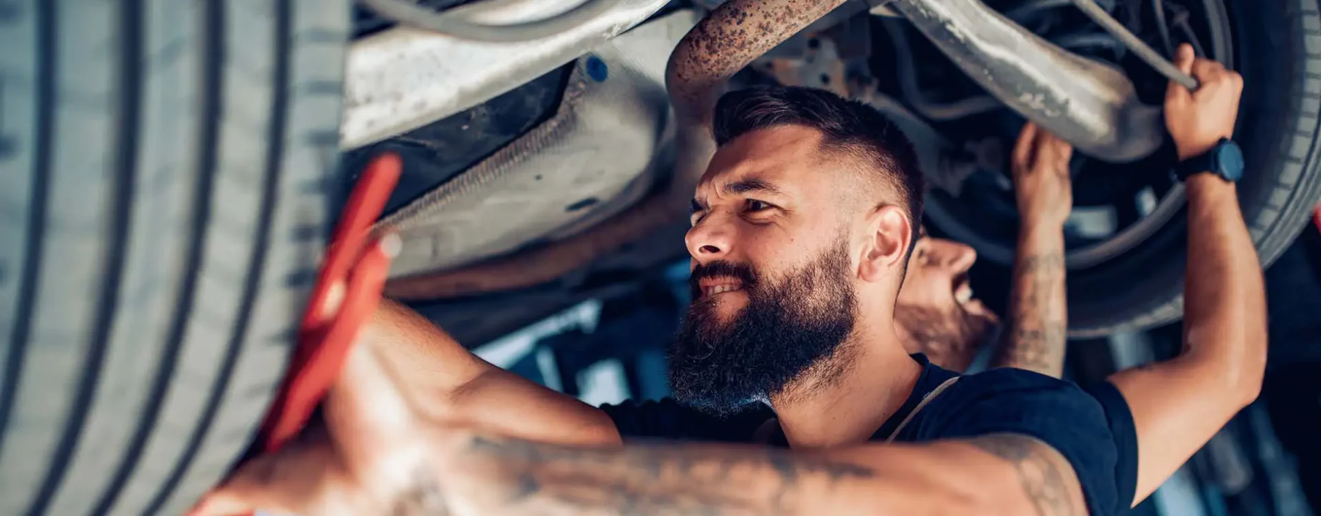 Two men working on an automobile