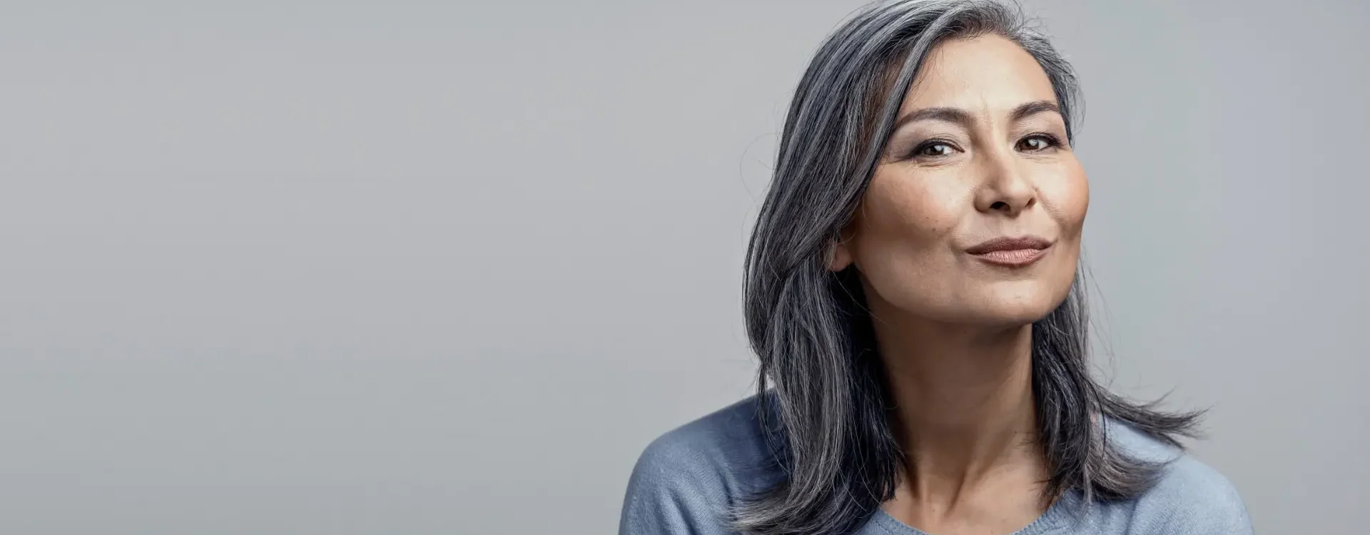 Aged woman posing for photo