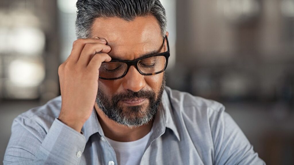 man with headache needs to find testosterone clinic near me