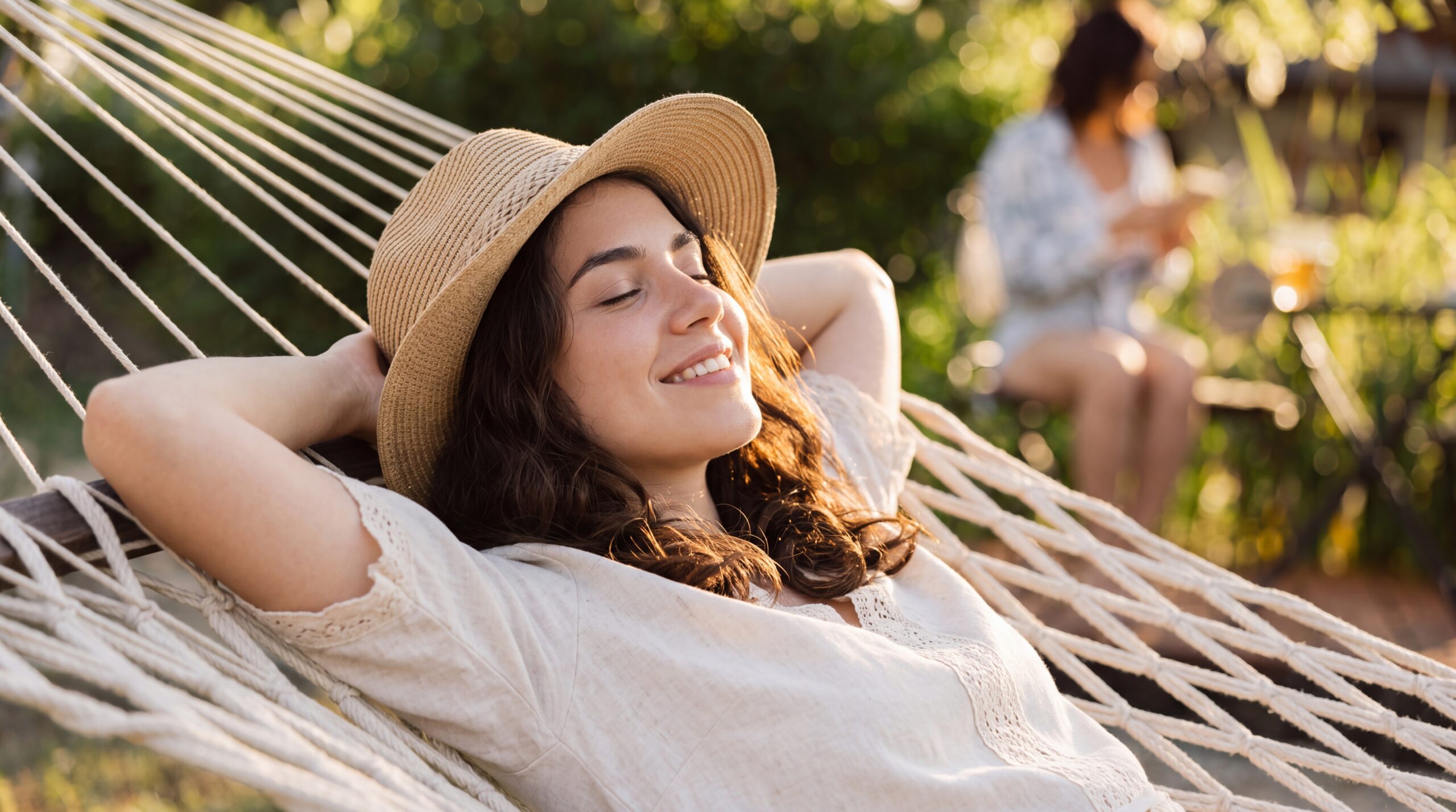 Woman outdoors in warm sunlight — hot flashes and night sweats